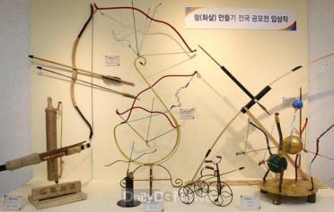 Display of bow and arrow sculptures
